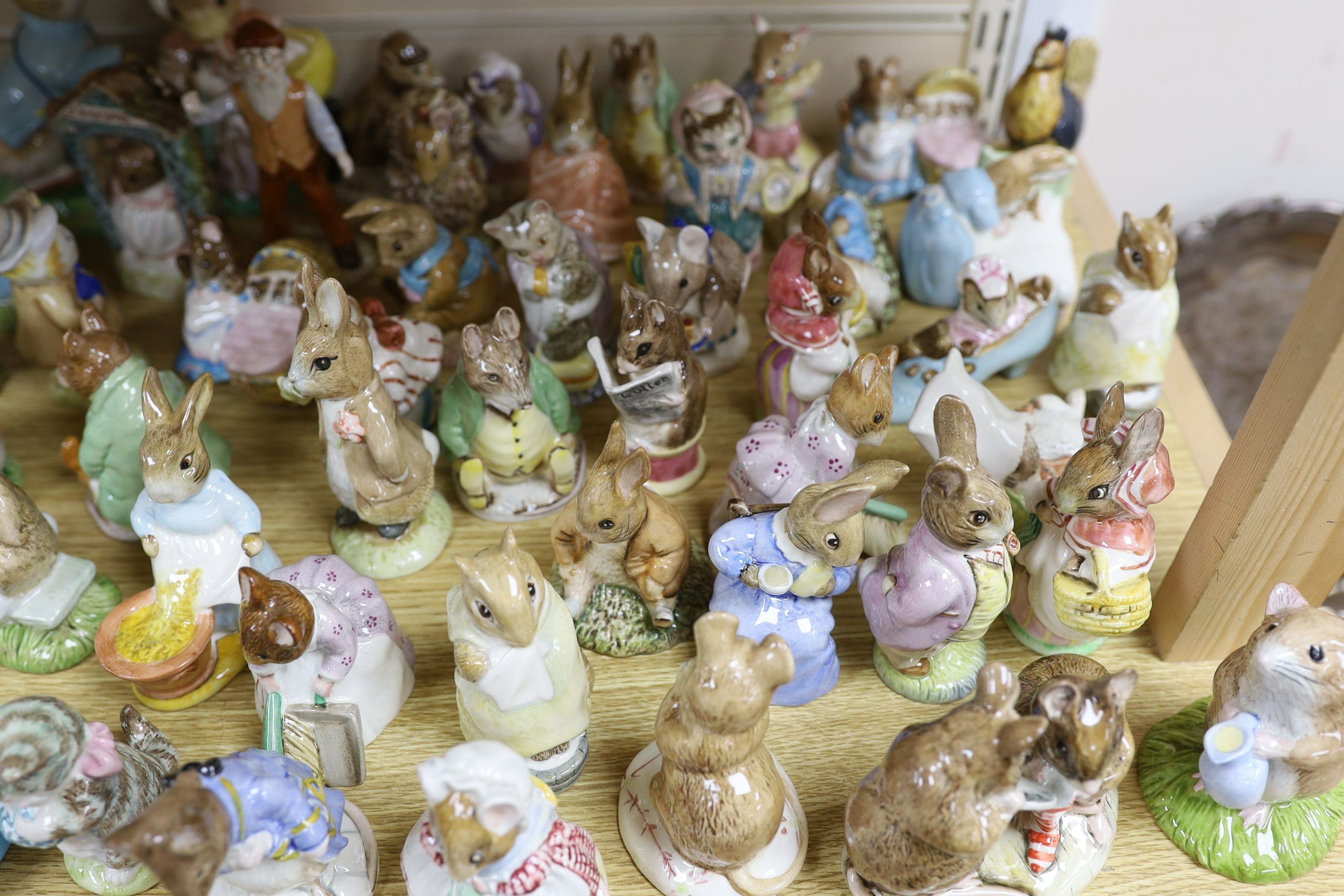 A large collection of Beatrix Potter ceramic figures by Royal Doulton, Beswick and Royal Albert, to include ‘Sir Isaac Newton’ and ‘Mr McGregor’